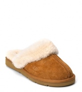 You will never want to take off these cozy, warm slippers with shearling lining and cuff from UGG® Australia. 1 rubber wedge and durable rubber sole.