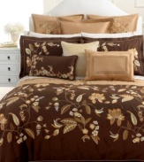 Embroidered loose bouquets and falling leaves embellish rich gold quilting for an ornate, artisan-inspired look.