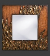 Overcome with lush grasses, this square wall mirror evokes the warmth and natural beauty of a sun-drenched pasture. Bending and overlapping in rich textural detail, each blade of grass is radiant in copper and bronze.
