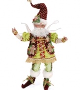 Keep company in the kitchen. Wearing a vest of gingerbread men and a cookie in his hat, this fantastical figurine from Mark Roberts inspires dazzling desserts from a windowsill or shelf. Bend his limbs to sit or stand.