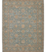Bring new distinction to your home. Marked by its delicate aqua color palette and luxuriously soft texture, this handcrafted rug recreates the elegance of 17th Century Persian carpets. Hard-twist yarns are specially dyed for a subtlety of coloration producing a vintage look similar to traditional vegetable dyes.