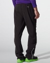 Designed for athletic endeavors and enhanced movement, a sleek athletic pant gets a modern update in stretch polyester jersey with sporty striped details at the sides.