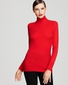 Exude smart, polished style when you layer this sleek Donna Karan New York turtleneck under blazers and sweaters, or let it hold its own over wide-leg pants.