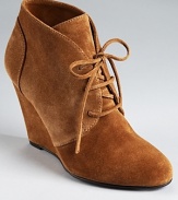 An almond toe lends a delicate touch to Via Spiga's Sophie booties--a laceup vamp gives a laid-back look.