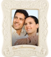 Never forget an anniversary. Crafted of glazed ivory porcelain, this Portrait Gallery picture frame from Lenox features scrolling vines and goldtone accents to complement a beautiful couple. Qualifies for Rebate