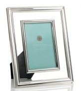 Your fondest memories are crystal-clear in this contemporary picture frame from Martha Stewart Collection. Silver-plated rims define luminous glass, accenting any room with flawless grace.