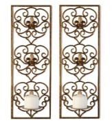 Warm up the home! Stacked pillar candles sit elegantly in front of Fleur-de-lys designs and are complemented by the shimmering gold tones of this romantic duo.