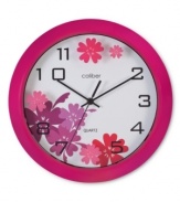 Turn back the clock with this fun, youthful wall clock. A magenta case and floral graphics on clear glass add fresh energy to bedroom walls. From Opal Clocks.