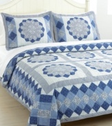 Blue blossoms in an array of fabrics create a mosaic of pure tranquility. The Blue Dahlia quilt set is hand-pieced for a traditional look and feel that makes a wonderful update for master and guest bedrooms alike.