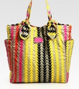 This vibrant carryall features signature letter stitching on printed nylon, complete with large over-sized pockets and knotted handles. Double top handles, 7½ dropMagnetic top closureTwo outside open pocketsOne inside zip pocketTwo inside open pocketsLogo-print lining14½W X 14½H X 4¼DImported