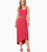 Infused with romantic movement, a sleek tank dress is crafted with subtle pleating at the waist that creates a fluid draped hemline.