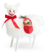 Sweet on Christmas, this snow-white llama has saddlebags stuffed with sugary treats. With the soft, flexible features and distinct charm of Annalee figurines.
