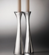 One of Nambe's most popular designs, the Tri-Corner candlesticks were designed by sculptor, Richard K. Thomas. These candlesticdks embody Nambe's guiding principles of design: objects for the home that are functional, as well as beautiful. An asymmetrical shape and high-polished metal combine to lend your home modern elegance.