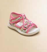 Vibrant flowers and contrasting trim adorn these sweet little t-strap sandals for baby.Adjustable buckle and grip-tape closureCanvas upperCanvas liningRubber solePadded insoleImported