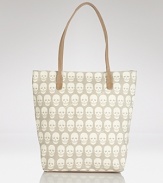 Hit print with this canvas tote from Treesje, splashed in an edgy skull motif. Hard-hitting yet practical, it's a style that's totally to die for.