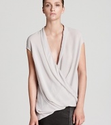 Master the elegance of draping in this Helmut Lang top with a low, crossover neckline and asymmetric hem. Slip into softness and refresh your look with luxury.