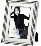 Add new elegance to beautiful memories with Vera Wang's With Love Blanc picture frame. Geometric detail lends metallic shimmer to creamy white enamel in a home accent that invokes modern and deco design.