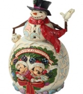 Celebrate the season with your favorite friends. Mickey and Minnie Mouse step in for Santa in this brightly colored scene, which combines bursts of Christmas color, winter wonderland designs and a very welcoming snowman.