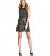 Jessica Simpson revamps a shift silhouette with a panel of inset lace, a cinched waist and scalloped hem.