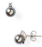 In a cool hue, Majorica's gray pearl earrings are dark, stormy and seriously chic. Slip them in as an alternative to classic whites.