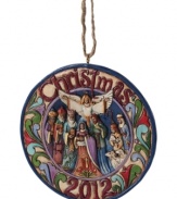 Gather round. A beautiful angel spreads her wings above Jesus, Mary, Joseph and friends in a Jim Shore ornament that will bring your family together, too.