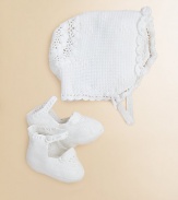 Perfect for a christening or other formal events, our exquisite bonnet-and-bootie set is hand-crocheted from luxuriously soft Pima cotton and finished with timeless heritage details for a precious heirloom look. Bonnet Buttoned chin strapBack panel with double-layered scalloped trim Booties Knit strap fastens over a knit pom-pom ankleSatin ribbon lacingPima cottonHand washImported