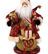 A richly ornamented version of the season's merriest symbol, Santa Claus is draped in lavish gold and burgundy wares in this heirloom figurine from Christopher Radko.
