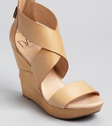 Wide straps and a boldly towering wedge are vacation-perfect. Pair DIANE von FURSTENBERG's sandals with tropical hues.