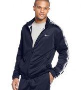 Dress the part of a pro athlete when you suit up in the ultra-smooth performance style of this Dri-Fit track jacket from Nike.