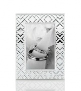 Mirroring the intricate folds of origami, this gleaming silver-plated picture frame makes art of any memory. From Martha Stewart Collection.