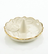 A single rose blossom and delicate dots carved in ivory porcelain make this classic ring holder a fine storage space for special jewelry. With a scalloped, gold-tipped rim. Qualifies for Rebate