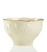 With lush roses and delicate dots carved in ivory porcelain, this classic bowl is a fine caddy for sweet treats. A scalloped, gold-tipped rim adds an element of grandeur to any tabletop. Qualifies for Rebate