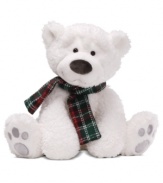 Two shining eyes peer out from a mass of bright white fur on a teddy bear that's far from the North Pole. A plaid scarf makes the Gund cub extra irresistible.