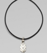 A carved sterling silver pendant drops from a finely braided leather necklace. From the Classic Chain Collection Sterling silver Leather Necklace, about 18 long Imported