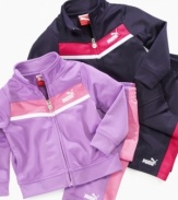 Track star style. Keep her warmed up when she's on the go in this cute, cozy look from Puma, with matching jacket and pants.
