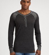 A classic henley sweater gets a contemporary feel in cozy, cotton accented by striped shoulder detail.CrewneckFour-button placketCottonMachine washImported