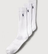 Polo Ralph Lauren set of three stretch cotton crew socks feature a cushioned foot and ribbed top. Polo player embroidered detail. Three pairs of socks per pair.