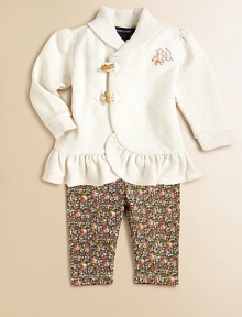 A comfortable set with a sweet, colorful look pairs a cozy fleece tunic top with an adorable floral-print stretch cotton jersey legging. Tunic Ribbed shawl collarLong sleeves with ribbed cuffsFront toggle closureRuffled hemLeggings Elastic waistbandSewn hemCottonMachine washImported Please note: Number of buttons may vary depending on size ordered. 