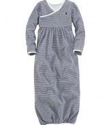An adorable long-sleeved gown is rendered in soft, striped cotton jersey.