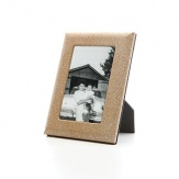 Supple shagreen-embossed fine Italian leather wraps this handcrafted frame in true luxury. A sturdy easel and easy access to photos makes it equal parts form and function.