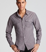 Front and back darts help shape the silhouette of this handsome button-down for a slimmer fit, and a solid, understated color provides versatility.