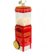 Skip popcorn balls and garland for an ornament that's literally popped to perfection. Advertising the hot, fresh movie theater favorite, it's hard to believe the vintage-style cart is handcrafted in pure glass. By Christopher Radko.
