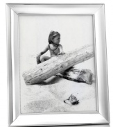 Classic good looks. The Concave picture frame lends timeless style to memorable moments, with an elegant silver-plated edge by Martha Stewart Collection.