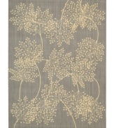 Enhance your living area with the beautiful look and sheen of Nourison's Capri rug. Woven of a blend of fine wool with Nourison's signature light-reflecting Luxcelle(tm) fibers, the luminous rug features a delicate leafy design across a soft slate background.