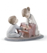 Play nice. Young musicians toil away on a miniature piano in a darling Lladro figurine that moms and dads will truly treasure.