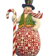 Painting a sweet scene in your home, this overjoyed snowman simply dazzles with a geometric folk-inspired print that plays brilliantly with the stripes of everyone's favorite Christmas candy. Seasonal colors jump off this snowman and add a friendly touch to any space.