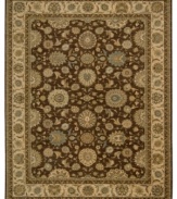 Floral medallions connected by a complex labyrinth of vines distinguish the well-composed design of this rug. Machine woven from the highest quality wool and meticulously dyed for a richly varied color palette to bring a unique accent of luxury to the home.