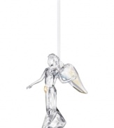 Inspire peace and tranquility with an awe-inspiring angel ornament. Shining in clear Swarovski crystal with iridescent wings and a golden star, it's a beautiful addition to the table or tree. Skirt engraved with 2012.