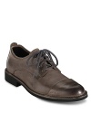 Cole Haan has crafted a striking cap toe oxford in rich, rustic leather, with concealed Nike Air™ Technology at the heel for extra cushion.