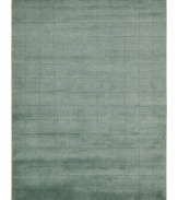 Skilled hand-carving creates an absorbing geometric block pattern on this premium Nourison area rug. Crafted with the timeless art of Tibetan hand-knotting, this deep blue piece features a soft blend of wool and Luxcelle fibers for a distinctive, satiny texture and sheen.
